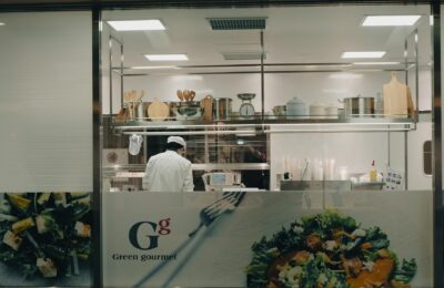 A chef cooking in a modern kitchen at night in Toyohashi, Japan.
