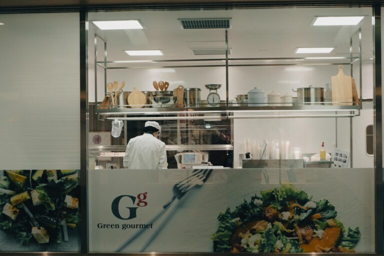 A chef cooking in a modern kitchen at night in Toyohashi, Japan.