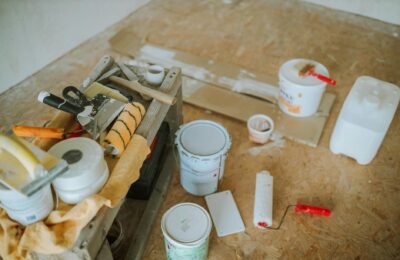 Overhead shot of tools and paint supplies for a home renovation project.