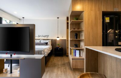Cozy and stylish studio apartment interior design in Bogotá with wooden accents.